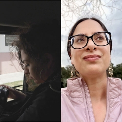 a woman with a camera, in shadow within a car with street scene through the window glass; a poet with eyeglasses, dark hair pulled back, light pink top and cloudy sky behind with tree branches