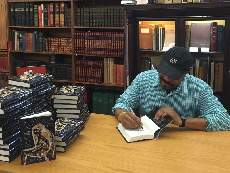 John Keene signing his book